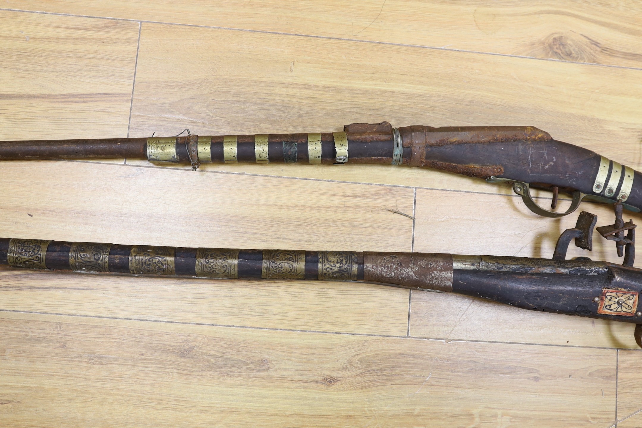 Two 18th century continental long arm rifles, longest 143 cms.